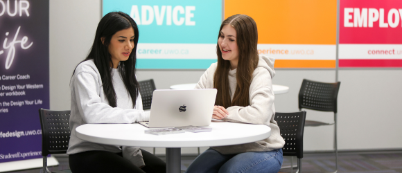 Students looking at resume together